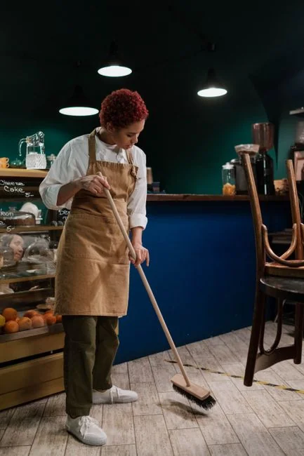 a-woman-is-cleaning-a-kitchen-sink-with-a-rag-sqomdoqb3ws